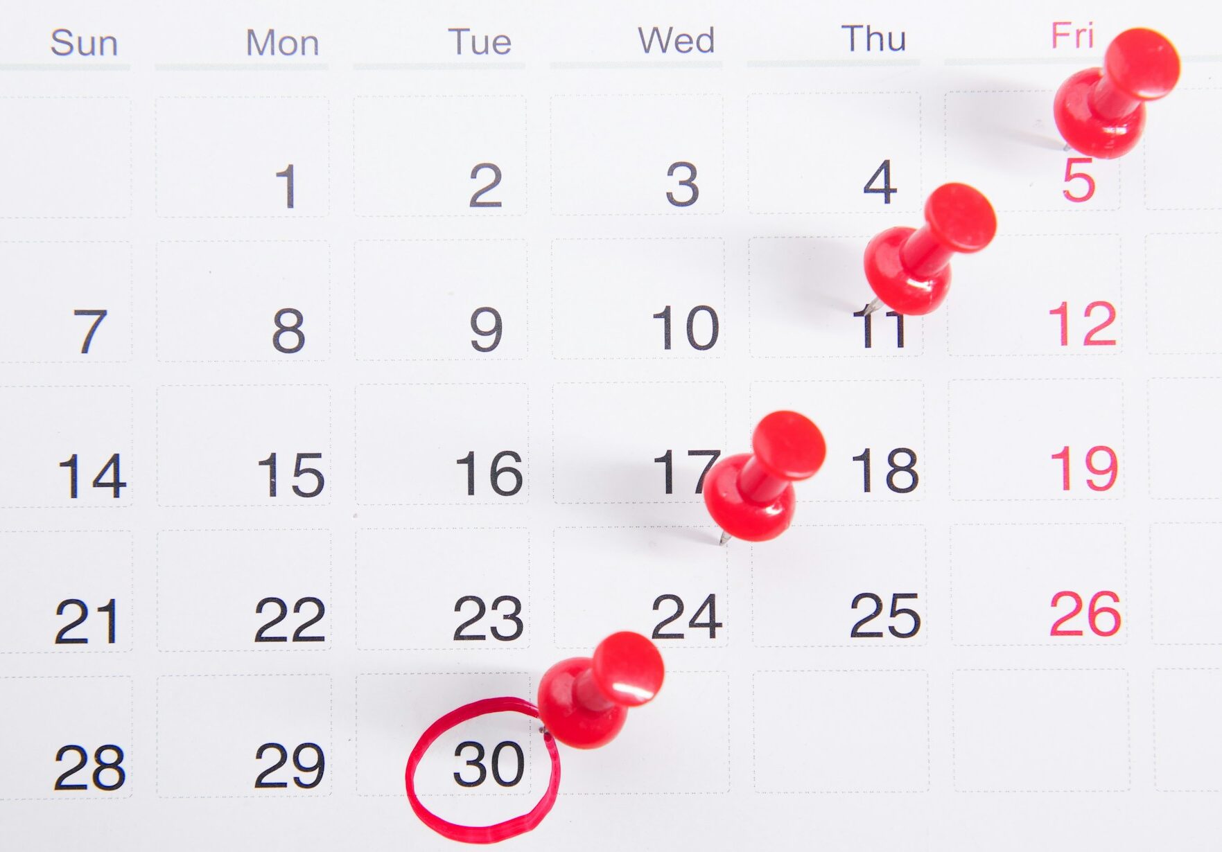 calender with pins and markers